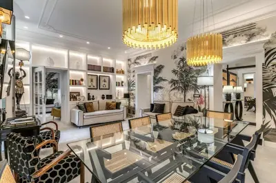 a living room with a glass table and chairs at Luxury flat with terrace by historic center in Rome