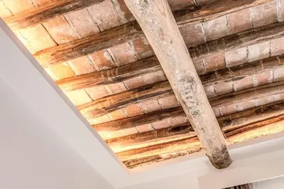 a wooden ceiling in a room at Effe Luxury Rooms in Rome