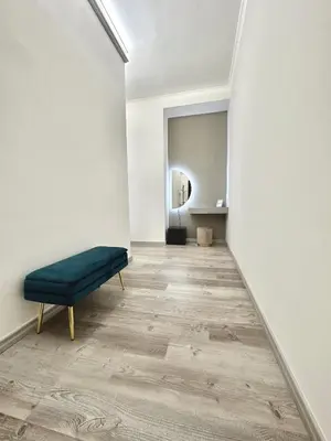 a room with a bench in the middle of a wall at Rhome in Rome
