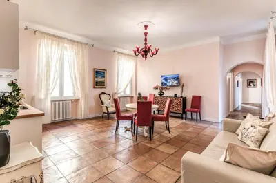 a living room with a table and chairs at Casa Vacanze Collina in Rome