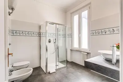 a bathroom with a shower and a toilet and a sink at Casa Vacanze Collina in Rome
