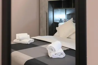 a room with a bed with towels on it at Domus Maria in Rome