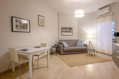 a living room with a couch and a table at Dreaming in Trastevere in Rome