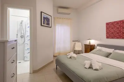 a bedroom with a bed with two pillows on it at Dreaming in Trastevere in Rome