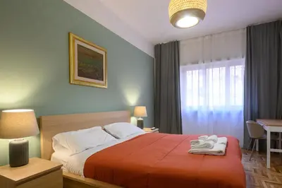 a bedroom with a bed with two towels on it at Prosper House in Rome