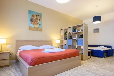 a bedroom with a large bed in a room at Prosper House in Rome