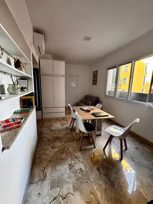 a living room with a couch and a tv at Trastevere Ripa Apartments in Rome