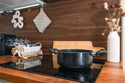 a kitchen counter with a pot on a stove at DAMA APARTMENT 2 camere da letto 2 bagni con doccia in Rome