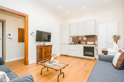 a living room with a couch and a table at DAMA APARTMENT 2 camere da letto 2 bagni con doccia in Rome