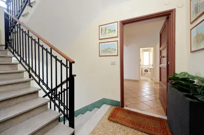 a staircase in a home with a stair case at Testaccio Sweet Holiday Apt in Rome