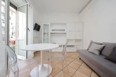 a living room with a table and a couch at Testaccio Sweet Holiday Apt in Rome
