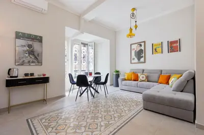 a living room with a couch and a table at Rome As You Feel - Charming Space at Torre Argentina in Rome