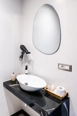 a bedroom with a white bed with towels on it at SONUS Colosseum in Rome