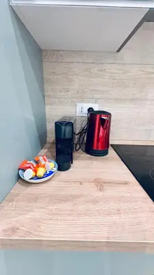 a counter with a plate of food and a toaster at Bold apartment 2 in Rome
