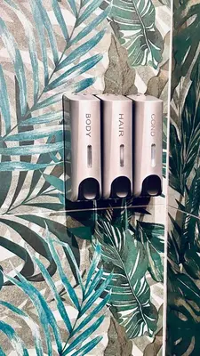 two batteries on a wall with tropical leaves at Bold apartment 2 in Rome