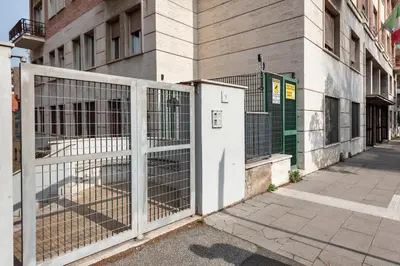 a gate on the side of a building at Private Condo Terrace & Parking in Rome