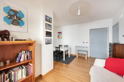 a living room with a couch and a table at Private Condo Terrace & Parking in Rome
