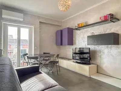 a living room with a couch and a table at Portuense Paradise in Rome