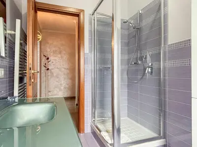 a bathroom with a green sink and a shower at Portuense Paradise in Rome