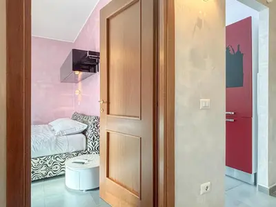 a door in a room with a bedroom at Portuense Paradise in Rome