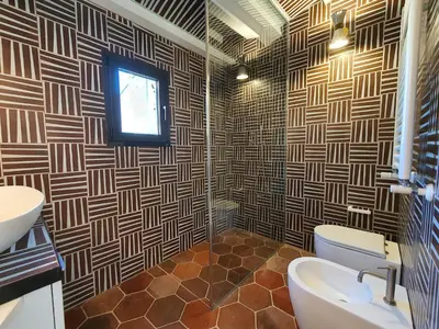 a bathroom with a toilet and a sink and a window at CS Stylish Loft with Terrace Spanish Steps in Rome