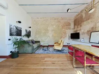 a living room with a couch and a table at CS Stylish Loft with Terrace Spanish Steps in Rome