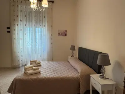 a bedroom with a bed with towels on it at Villa dei fiori in Rome