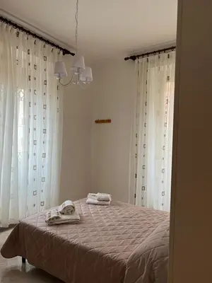 a bedroom with a bed with two towels on it at Villa dei fiori in Rome