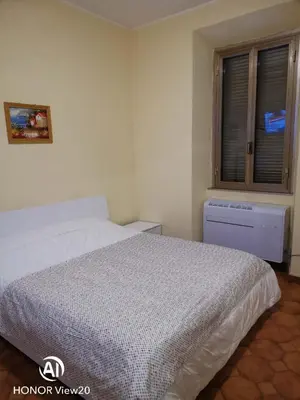 a bathroom with a sink and a mirror and towels at DuPigne' House in Rome