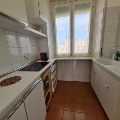 a kitchen with a sink and a counter top at L' attichetto in Rome