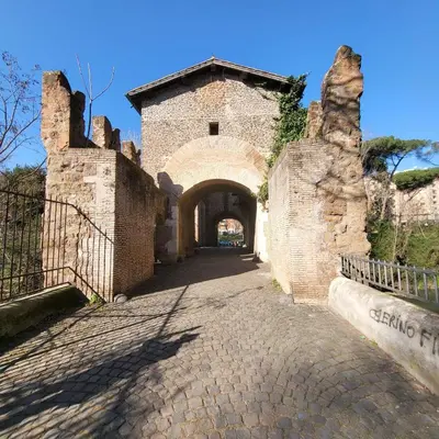 an entrance to a brick building with an archway at L' attichetto in Rome