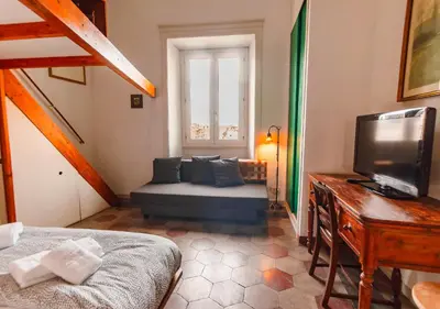 a small living room with a couch and a tv at Vicino alla Basilica di Santa Maria Maggiore in Rome