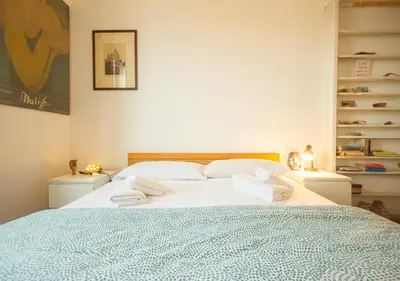 a bedroom with a large bed with towels on it at Vicino alla Basilica di Santa Maria Maggiore in Rome