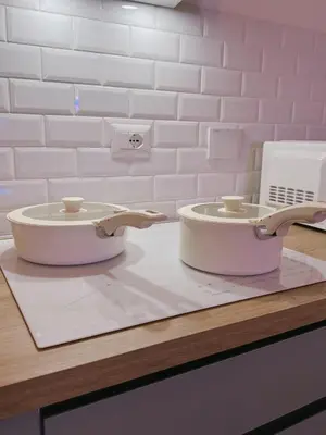 two clocks sitting on top of a counter at Vacanze Romane House in Rome