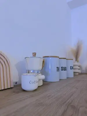 a group of white containers sitting on a table at Vacanze Romane House in Rome