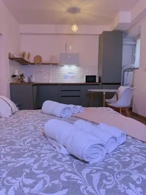 a bedroom with a bed with towels on it at Vacanze Romane House in Rome