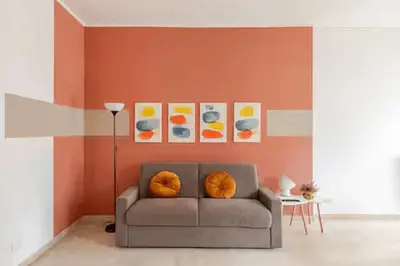 a living room with a couch with oranges on it at Casa Bella in Rome