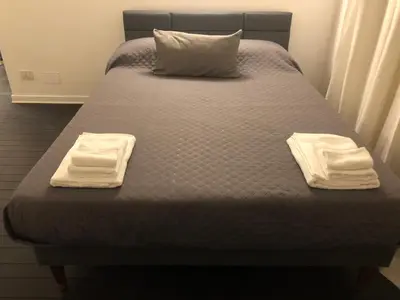 a bed with two towels on top of it at Vatican 3th Floor in Rome