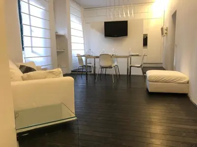 a living room with a couch and a table with chairs at Vatican 3th Floor in Rome
