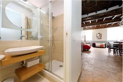 a bathroom with a sink and a glass shower at Limani - Campo de' Fiori Private Retreat in Rome