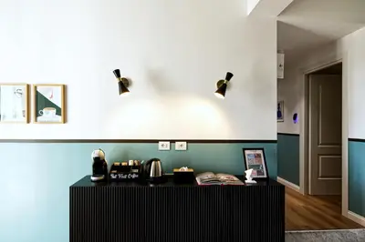 a living room with a glass table and chairs at Savi Guest House metro B S Paolo in Rome