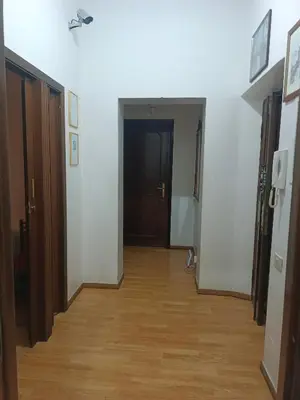 a hallway with a hallway leading into a room at Niam House in Rome