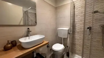 a bathroom with a sink and a toilet and a shower at Raffy in Rome in Rome