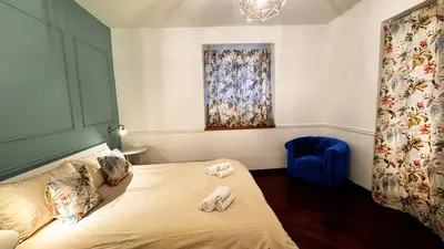 a bedroom with a bed with two towels on it at Raffy in Rome in Rome