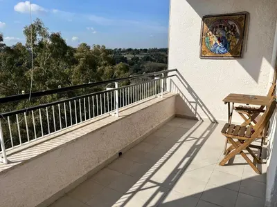 a balcony with a table and a painting on the wall at Holidays in Rome at Luigi's in Rome