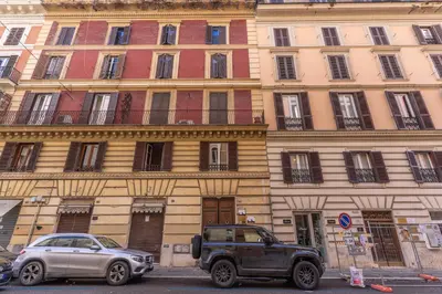 a truck parked in front of a large building at Fresh House Ludovisi in Rome