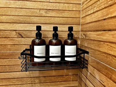 three bottles of wine on a rack on a wall at Casa Bixio Fantastico appartamento nel cuore di Roma in Rome