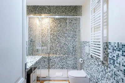 a bathroom with a shower with a toilet and a sink at ST PETER APARTMENT metro at 3 minutes in Rome