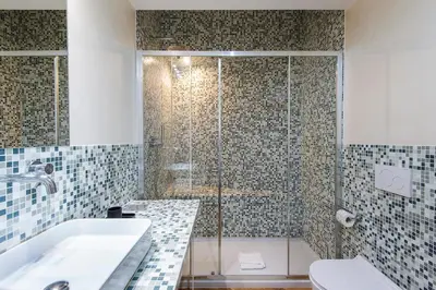 a bathroom with a tub and a sink and a shower at ST PETER APARTMENT metro at 3 minutes in Rome