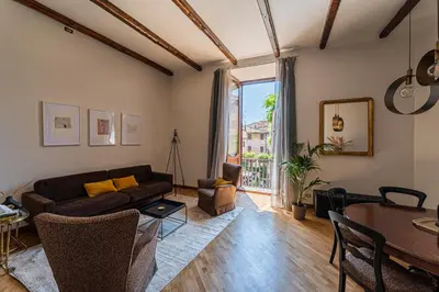 a living room with a couch and a table at Margana Luxury 3 bedrooms amazing terrace in Rome